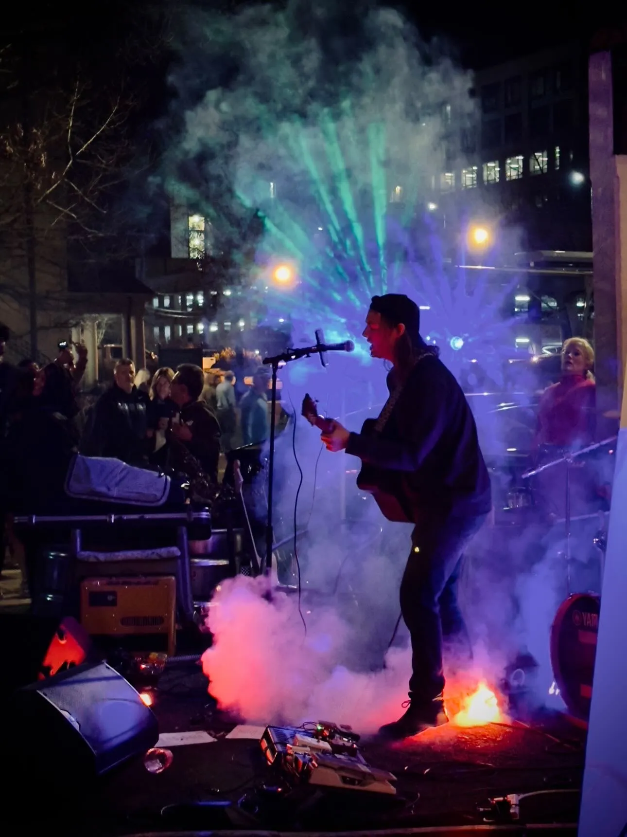 Live band performing on stage at a Triangle event